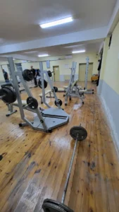 Mila Chervenkova lifting weights at an old school gym